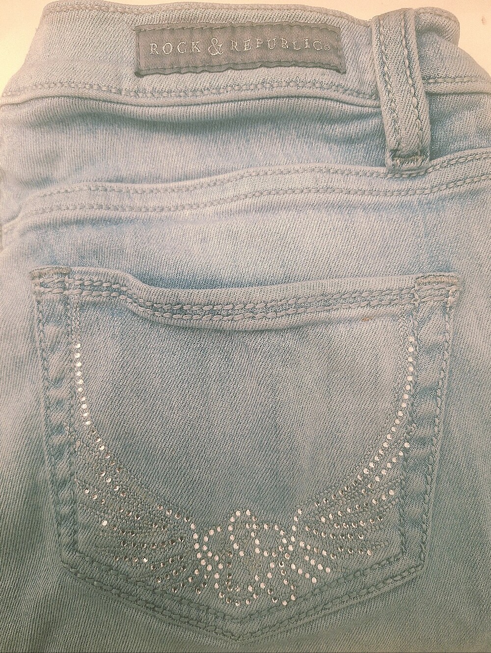 Rock & Republic Light Blue Jean Capris with Rhinestone Wing Pockets.